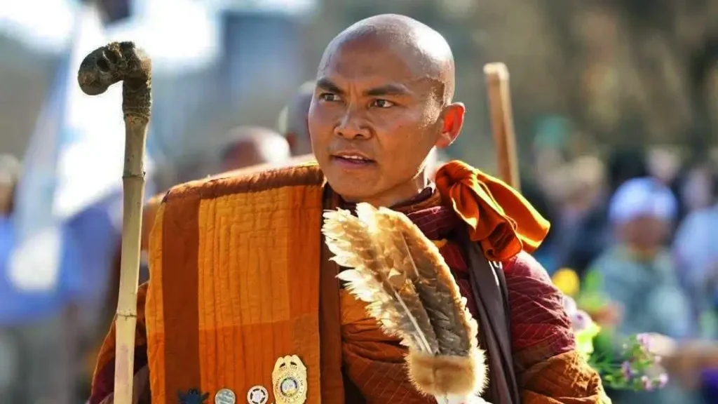 **Caption:**
“Leader of the monk procession guiding the Walk for Peace, representing nonviolence, unity, and spiritual leadership.”

**Alt text (SEO-optimized):**
“Buddhist monk leader leading a group of monks during the Walk for Peace, promoting peace, compassion, and harmony in the community.”
