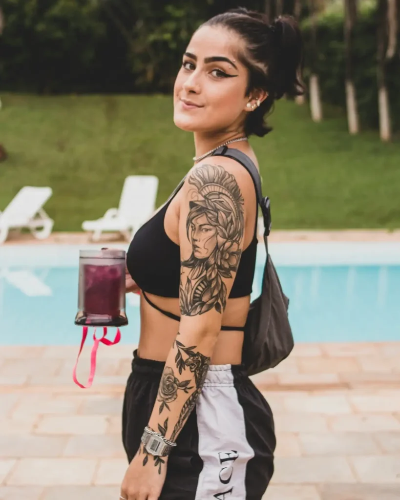 confident woman displaying meaningful arm tattoo