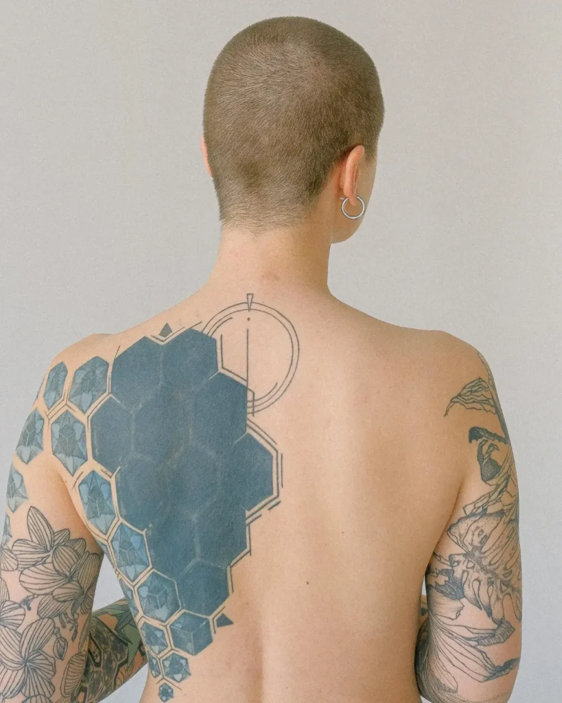 woman with  tattoo on the back