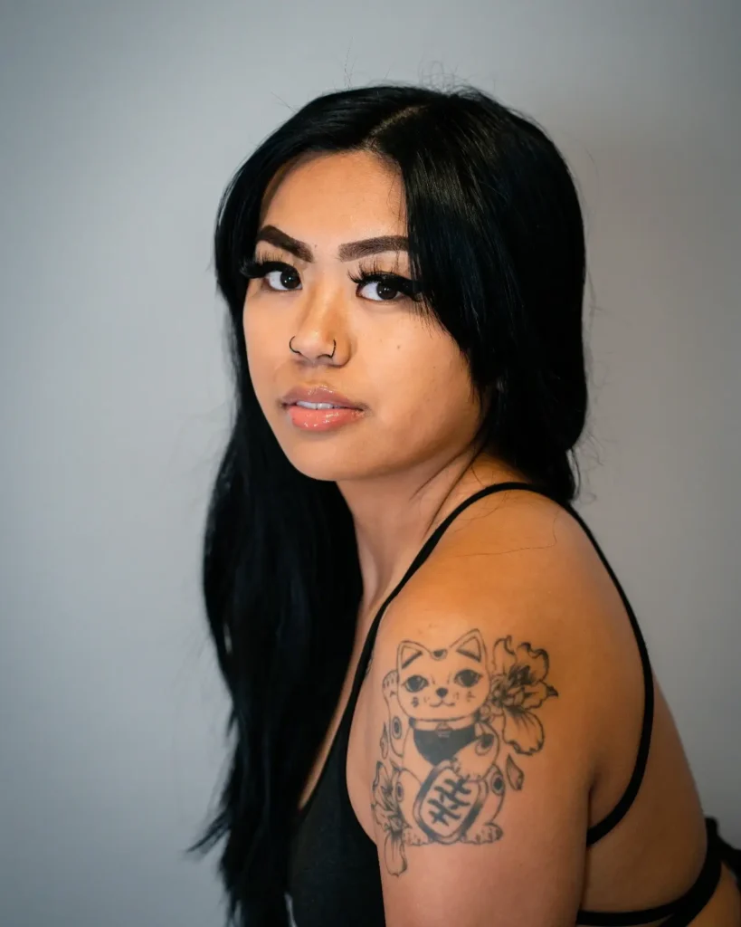 woman proudly showing empowerment ink Art