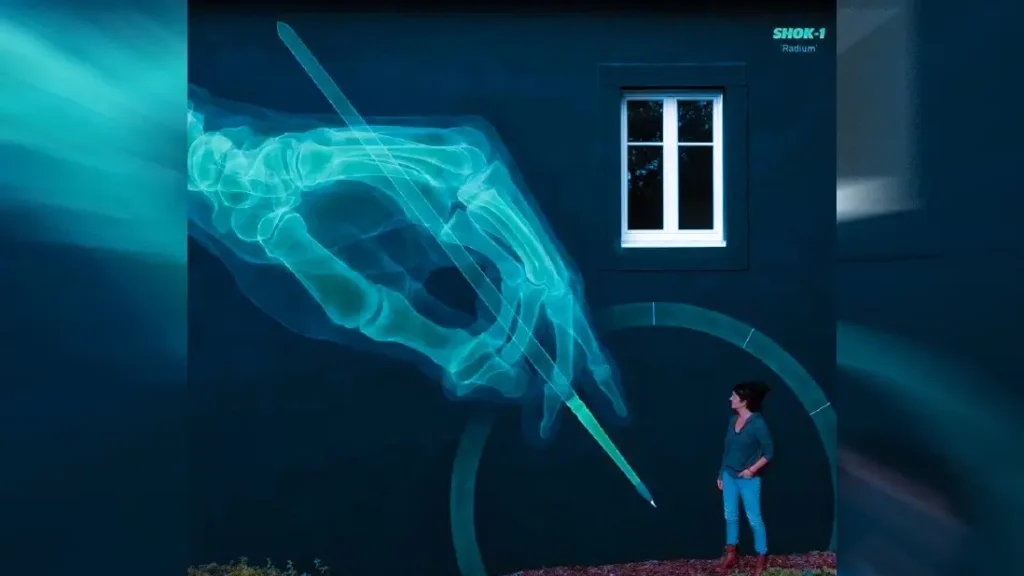 A glowing X-ray hand mural illuminates